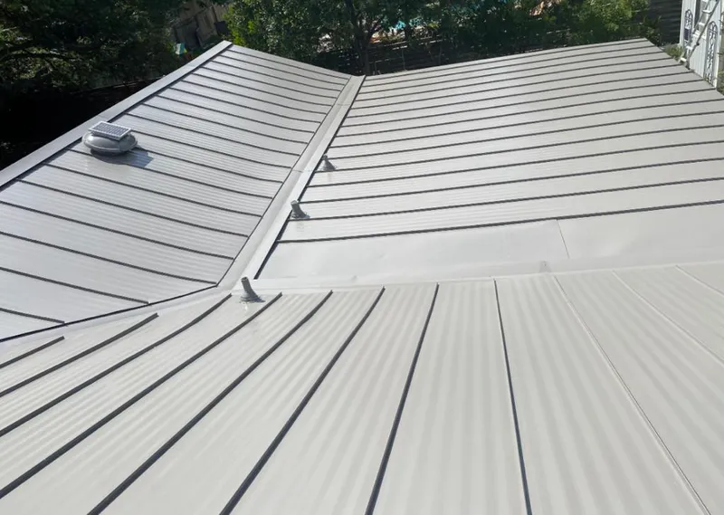 Solar attic fan installed on a metal roof for Roof Ventilation in Euclid